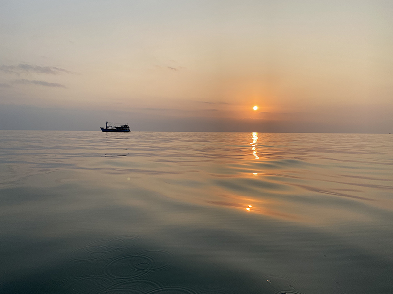 boat on the water in the sunset