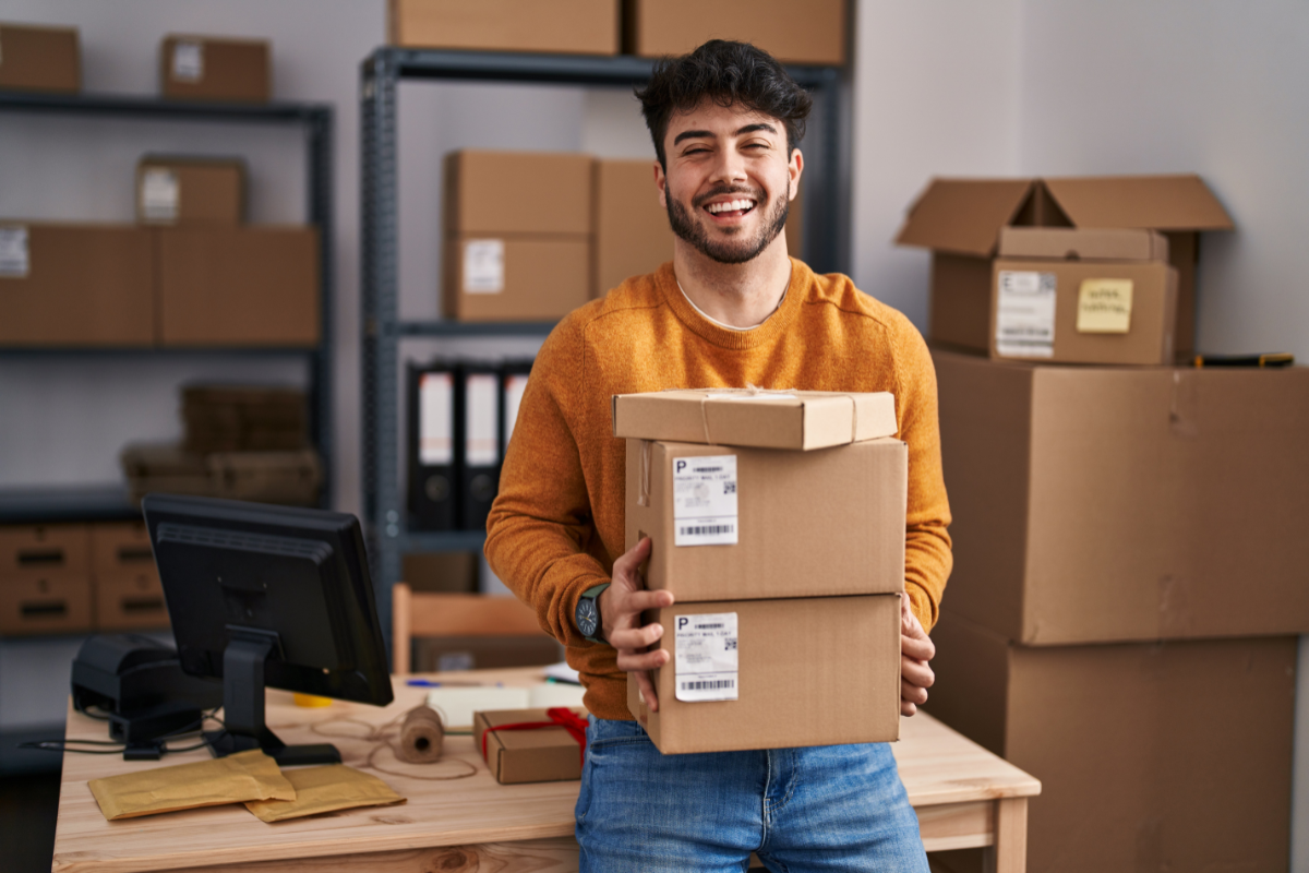 Business owner holding ready to ship out packages