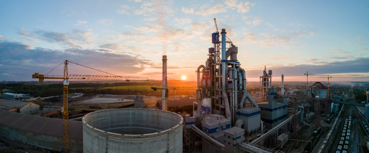 cement factory tower with high concrete plant structure at industrial production area